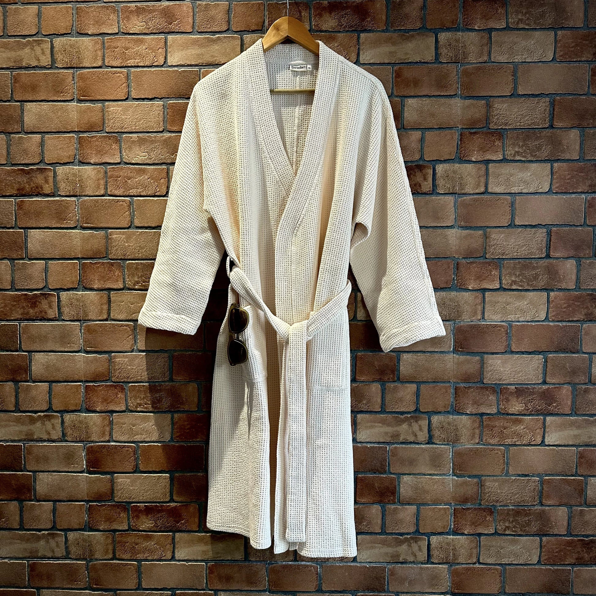 "Baradari pure cotton waffle bath robe in tan folded flat with hang tag — organic cotton unisex bath robe XL size by Baradari"